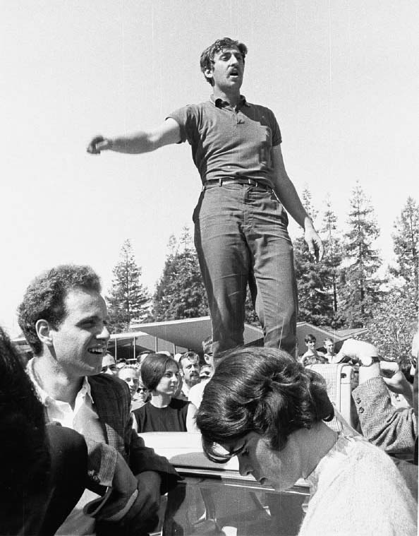 Jack Weinberg atop car by Steven Marcus